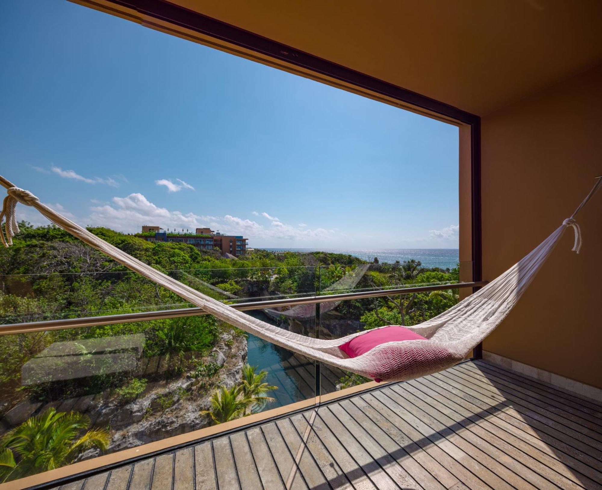 Hotel Xcaret Mexico All Parks All Fun Inclusive (Adults Only) 신데 델 카르멘 외부 사진 Hammock on a balcony